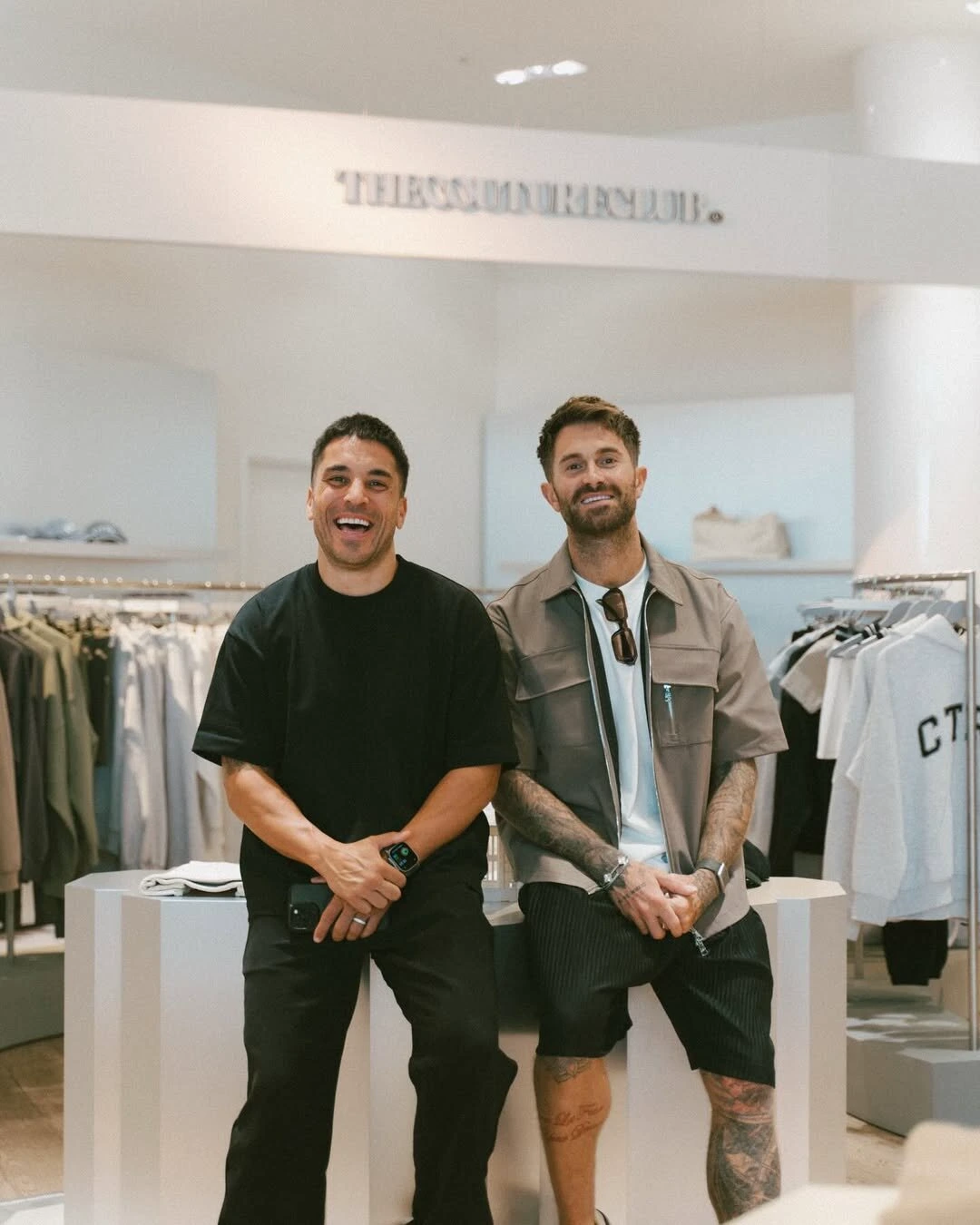 Ross and Scott photographed together in a retail space